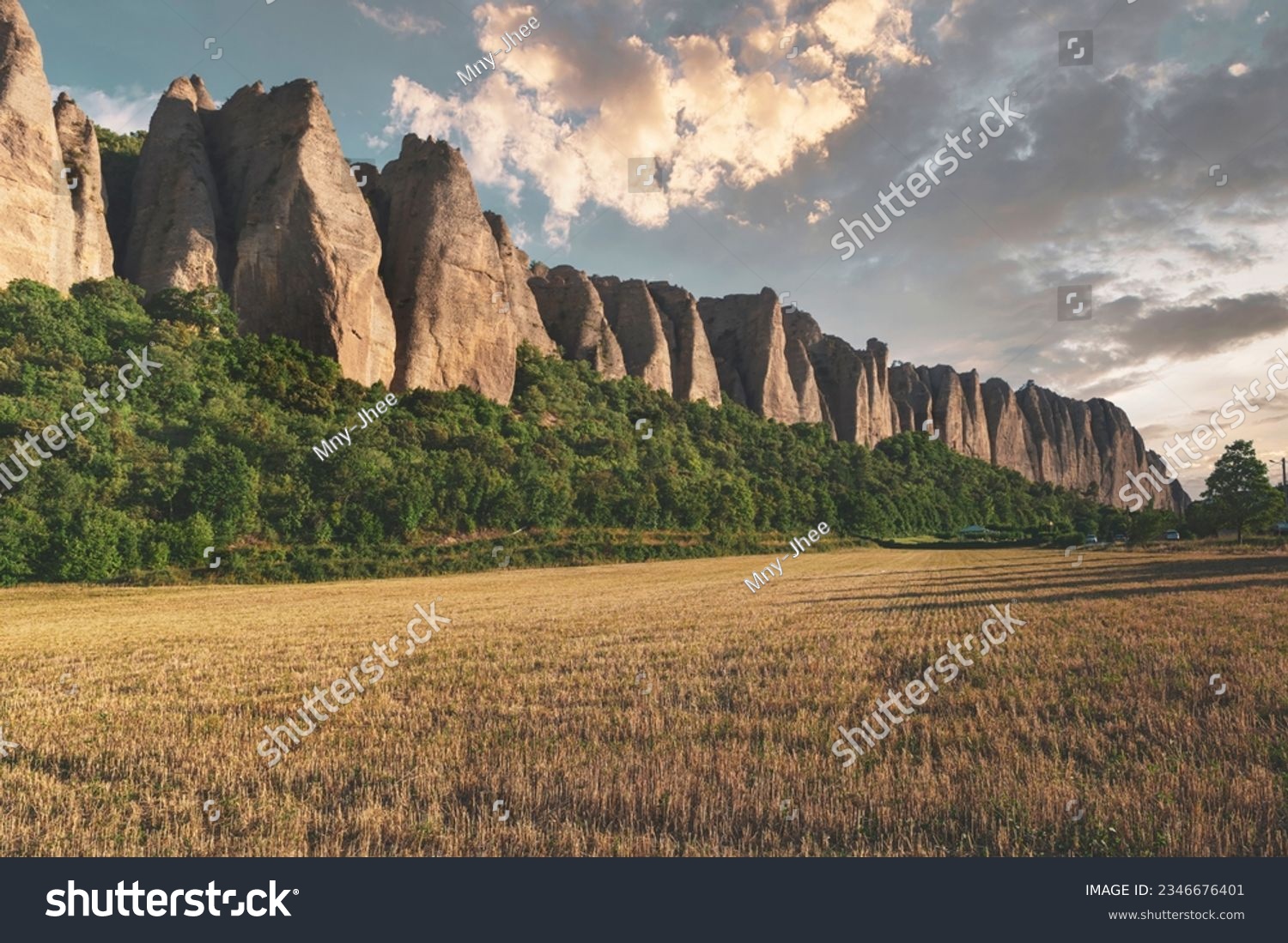 Scenic view with sharp dragon teeth rocks at the sunset. Penitent rocks in Provence, France #2346676401