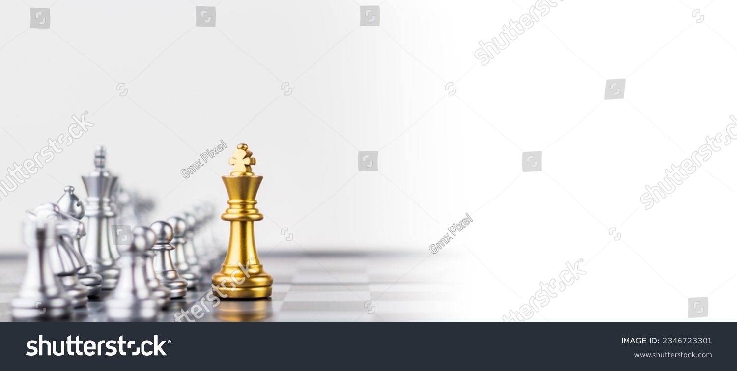 Leader, business strategy and planning concept, Gold Chess king figure on Chessboard and surrounded by a number of fallen silver chess pieces against opponent or enemy. Conflict, tactic, politic. #2346723301
