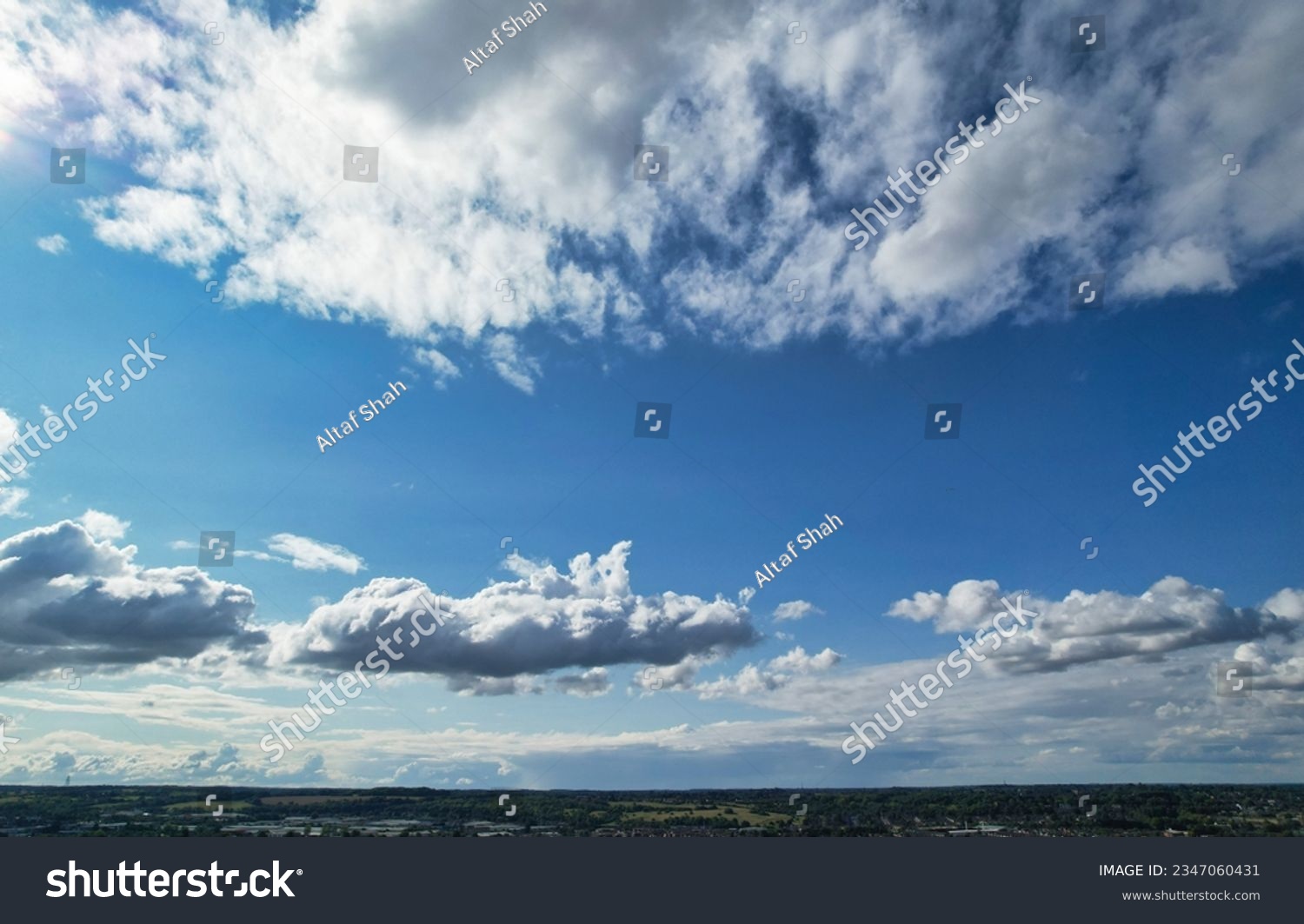 Low Angle Camera Footage of Dramatic Clouds and Blue Sky over The Luton City of England UK. August 6th, 2023 #2347060431
