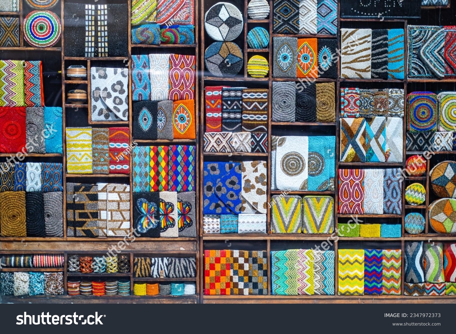 Neat arrangement showcases a variety of vibrant cloth patterns #2347972373