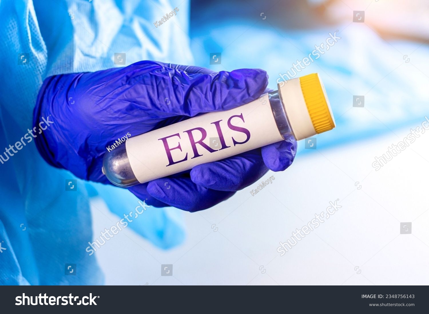 New infectious Eris variant of covid disease (EG.5) sample in lab tube in the scientist hand in blue medical glove on light background #2348756143