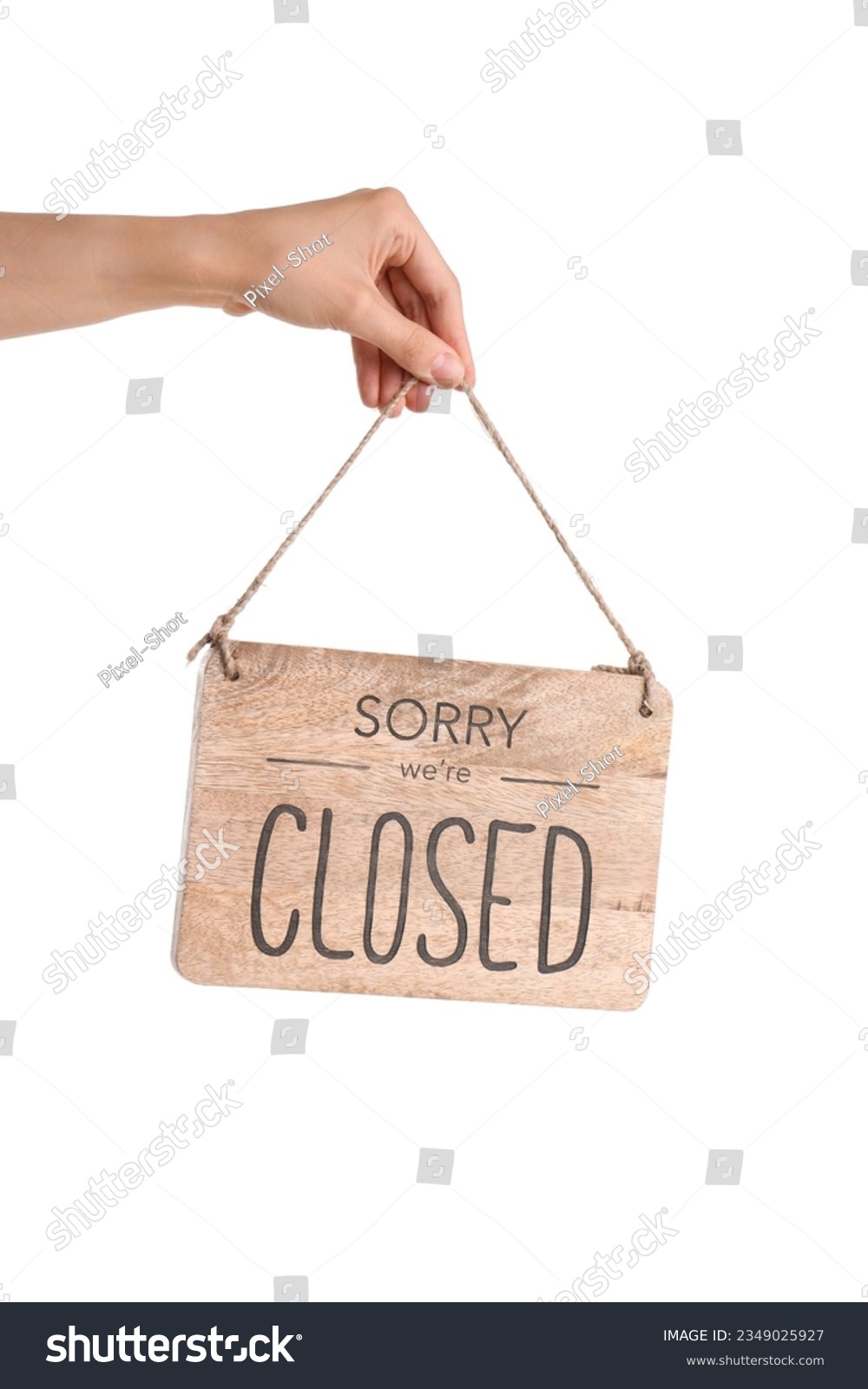 Female hand holding sign with text SORRY WE'RE CLOSED on white background #2349025927