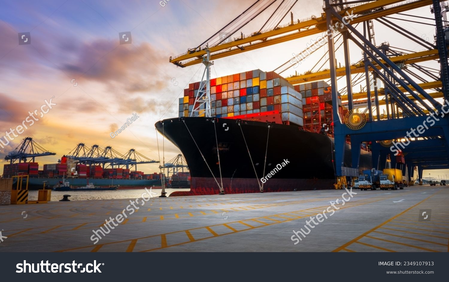 Crane loading Cargo Container export container ship in the international terminal logistics sea port concept freight shipping by ship, Truck running in port under the Big Crane transport trade #2349107913