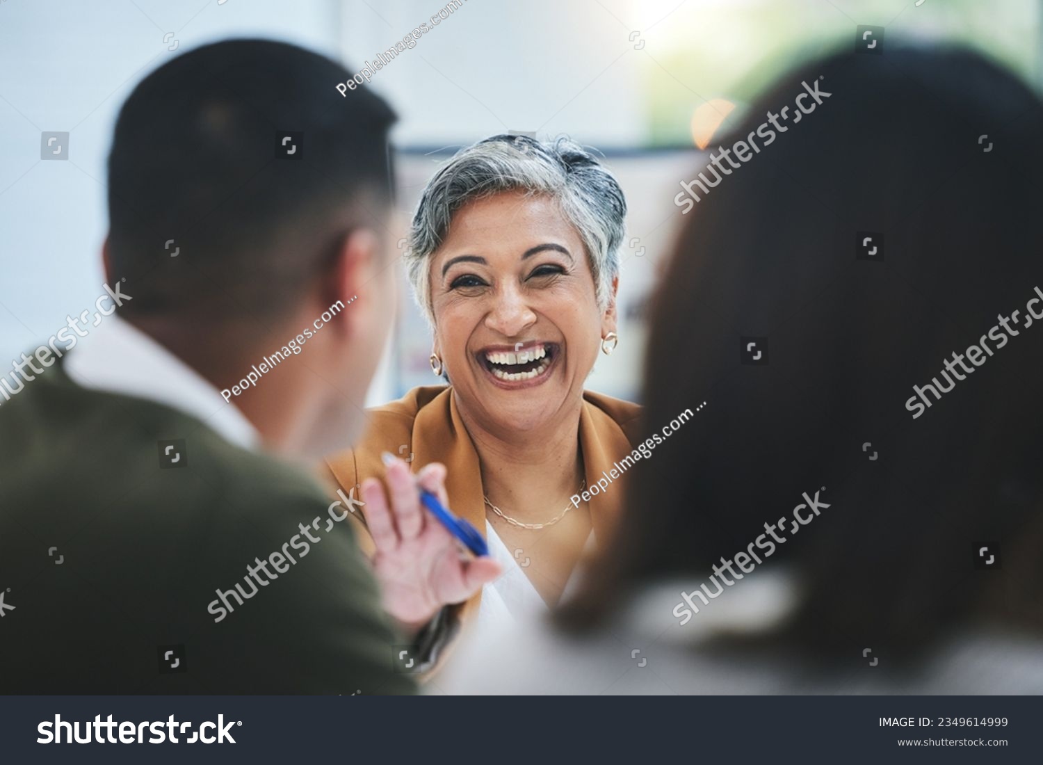 Team, happy woman or business people in meeting laughing at funny joke in discussion or collaboration together. Smile, leadership or excited mature mentor talking or speaking of ideas to employees #2349614999