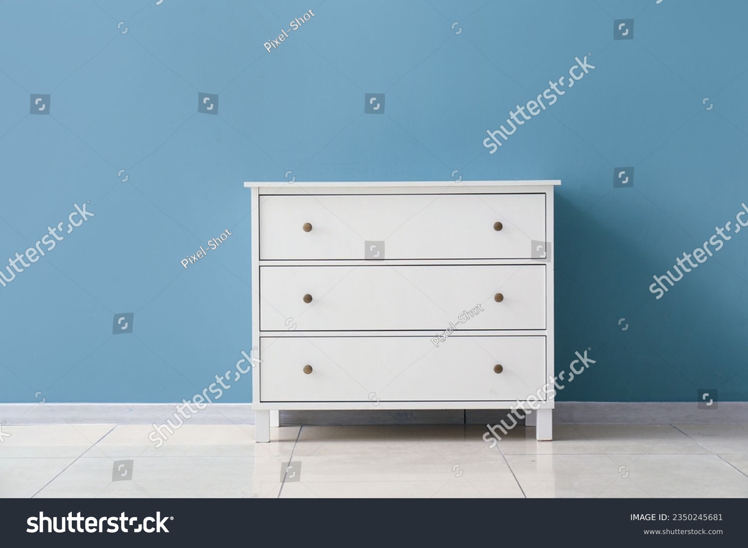 Stylish chest of drawers near color wall in room #2350245681
