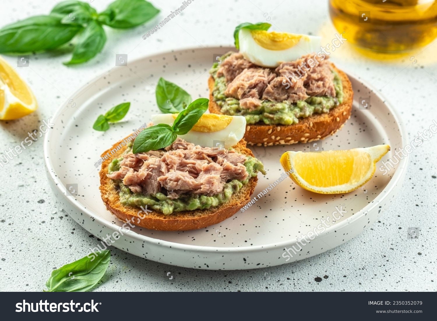 sandwiches with canned tuna, boiled egg and avocado. Food recipe background. Close up. #2350352079