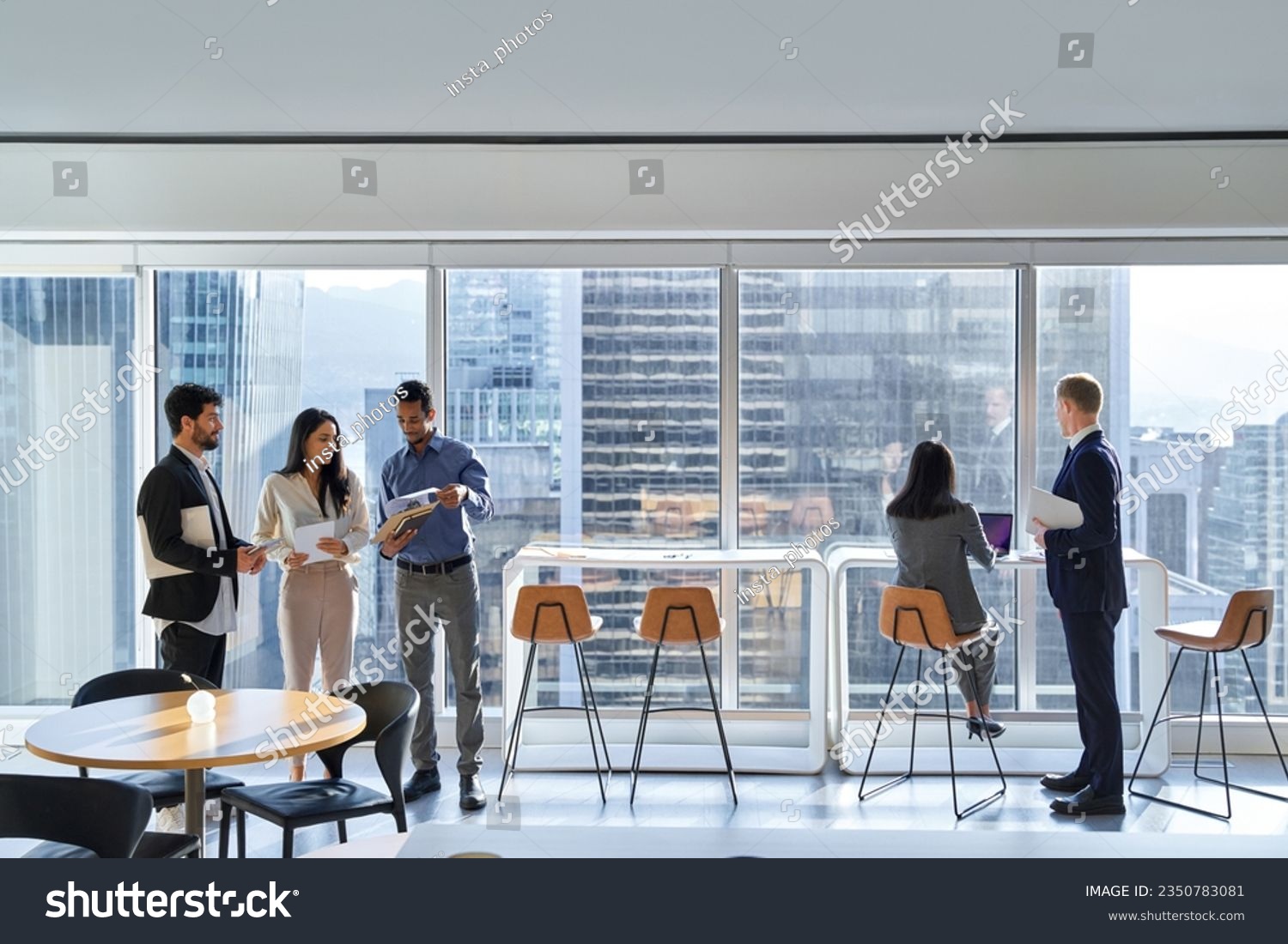 Diverse professional international team business people workers group working in corporate office space, diverse colleagues discussing work having teamwork conversations together at meeting. #2350783081