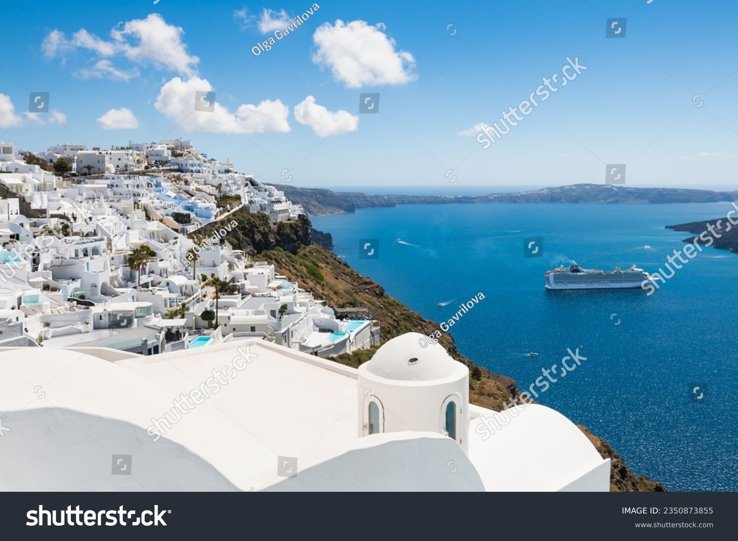 White architecture in Santorini island, Greece. Beautiful sea view in sunny day. Travel and vacation concept #2350873855
