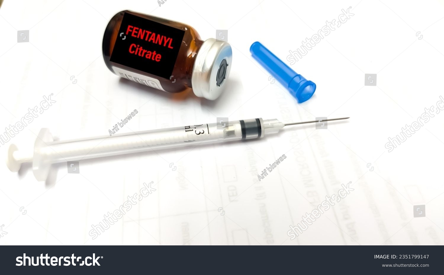 Fentanyl Citrate Solution for analgesic treatment. Doctor holding injection of medication of Fentanyl is opioid used to palliate pain or for anesthetic #2351799147