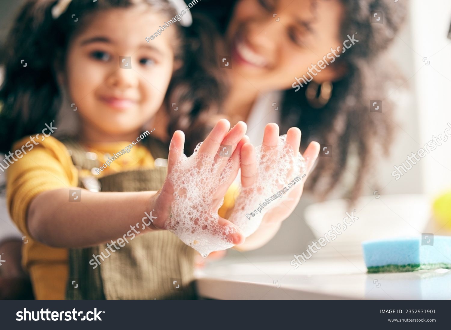 Soap, cleaning hands and family with child in bathroom for learning healthy hygiene routine at home. Closeup, mom and girl kid washing palm with foam for safety of bacteria, dirt or germs on skincare #2352931901