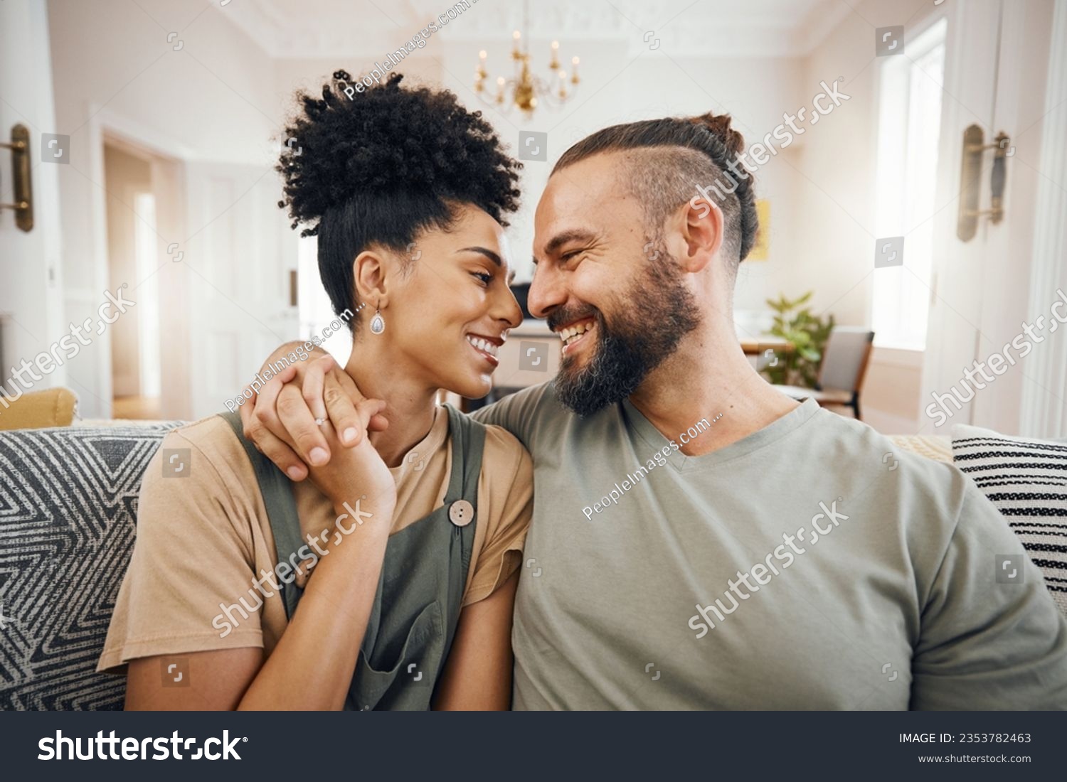 Happy, love or interracial couple on a sofa, care or commitment with relationship, weekend break or loving together. Home, man or woman on a couch, marriage or romantic with bonding, date or relax #2353782463