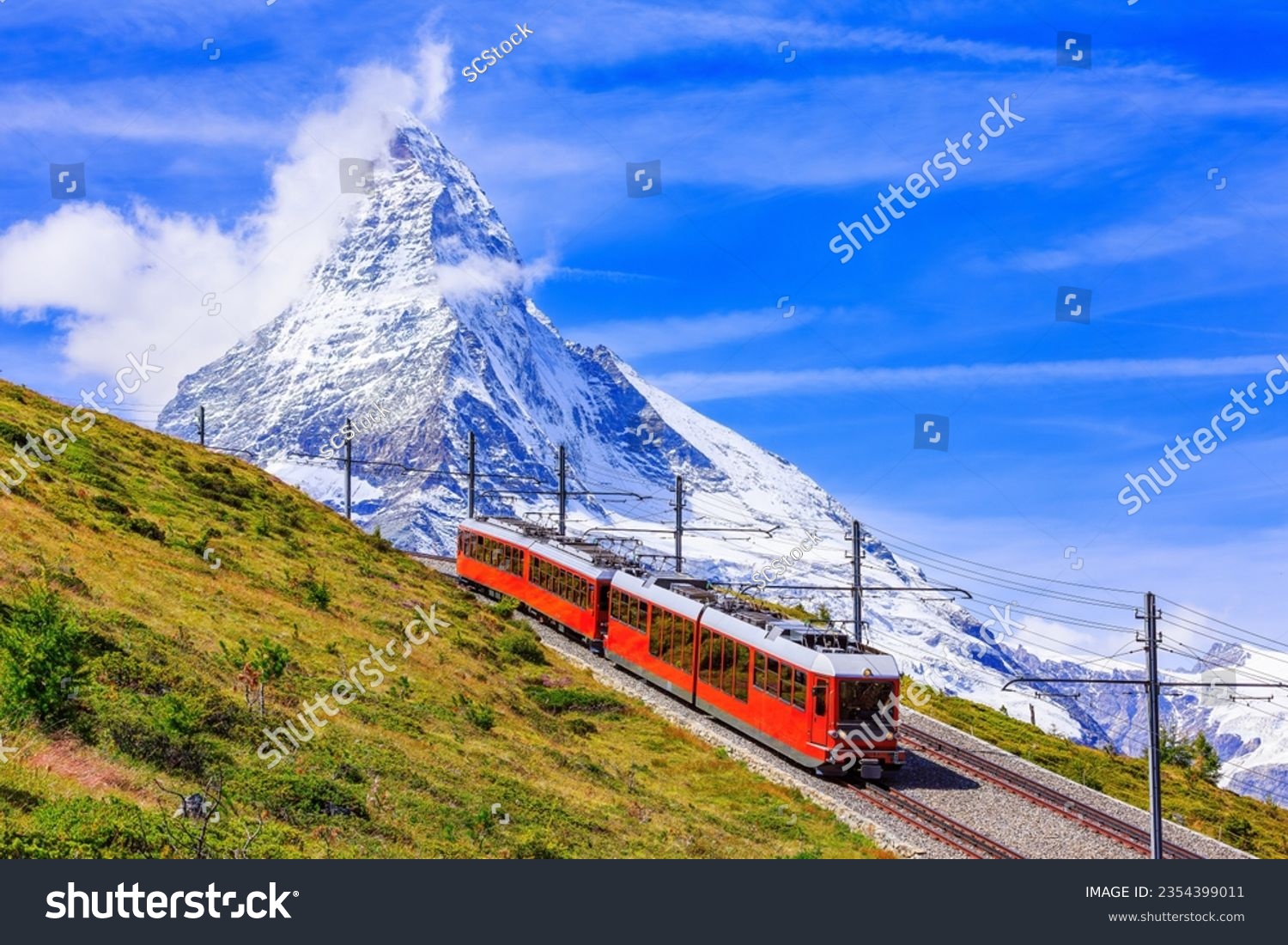 Zermatt, Switzerland. Gornergrat tourist train with Matterhorn mountain in the background. Valais region. #2354399011