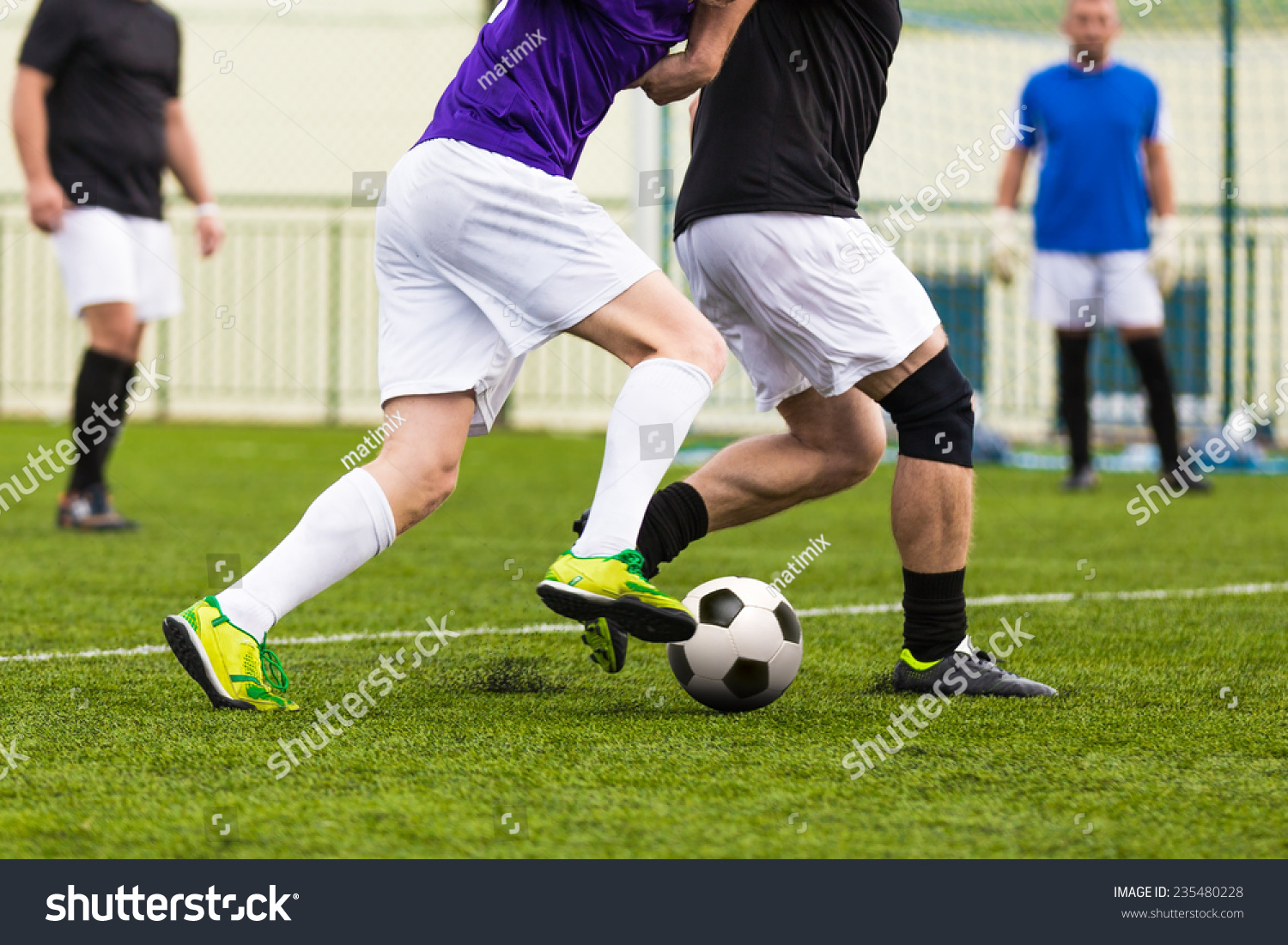 football soccer game. competition between two running players footballers #235480228