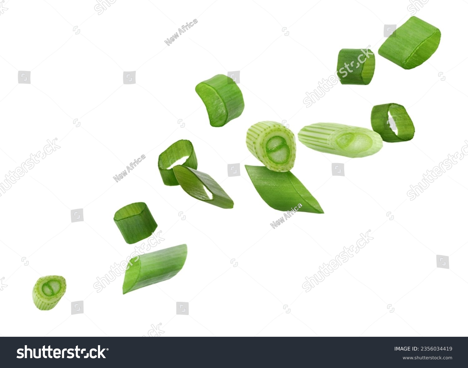 Cut green onion falling on white background #2356034419