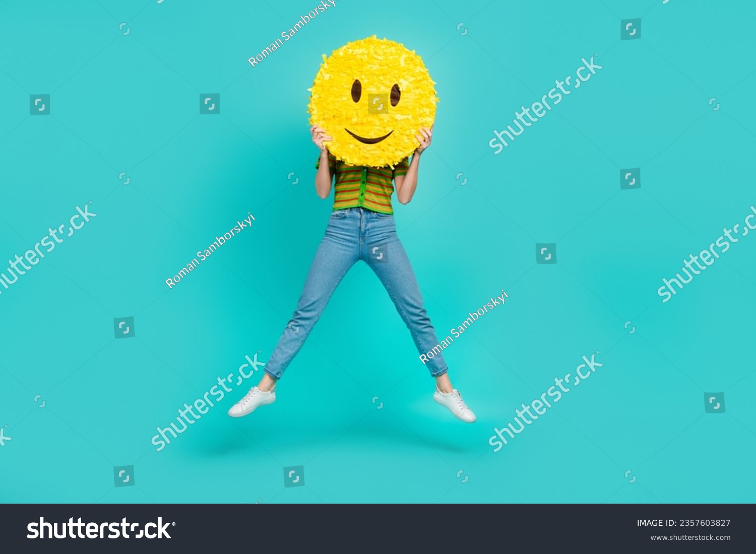 Full body portrait of carefree crazy lady jumping arms hold big smiley emoji isolated on turquoise color background #2357603827
