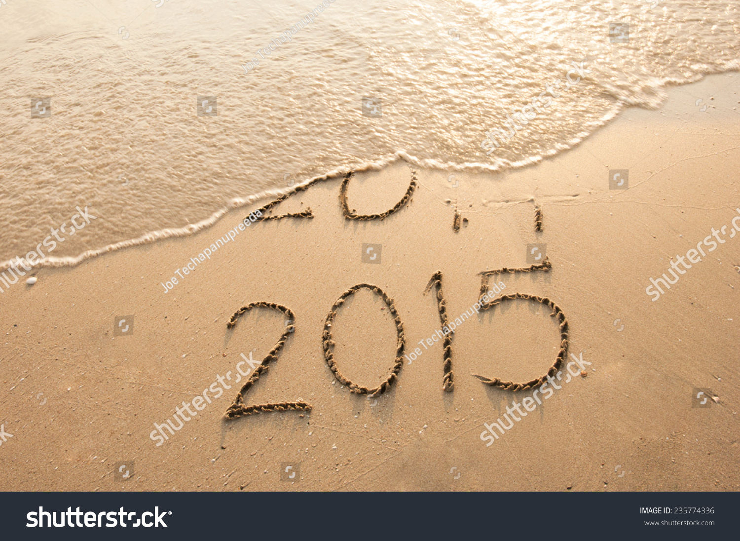 Year 2015 Coming written on the beach #235774336