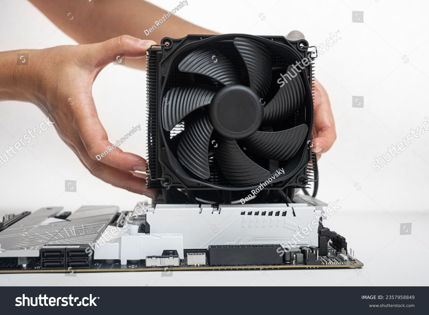 Installing a large air cooler on a computer processor. #2357958849