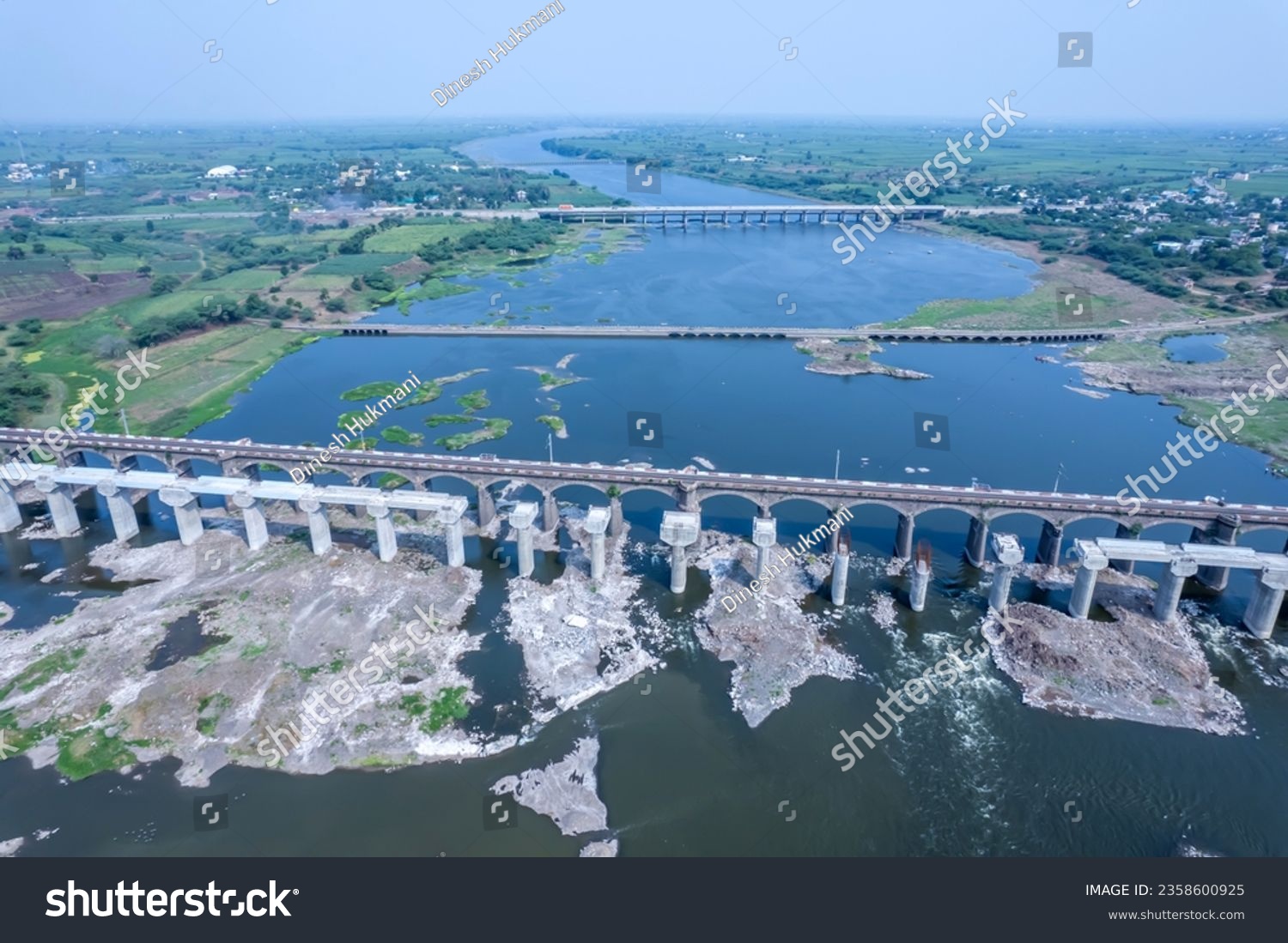 Aerial footage of the River Bhima and surrounding landscape including bridges at Daund India. #2358600925