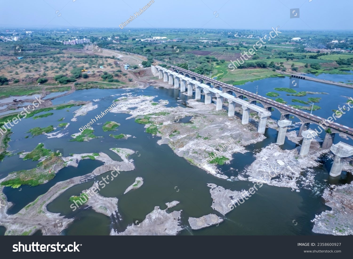 Aerial footage of the River Bhima and surrounding landscape including bridges at Daund India. #2358600927