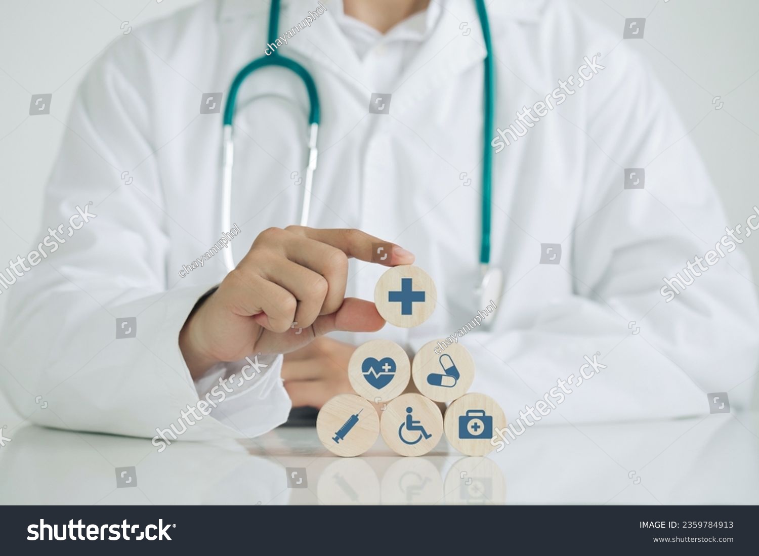 Doctor hand arranging wood block with healthcare medical icons. Healthcare and Medical Insurance concept.Good Healthcare.World Health Day. #2359784913