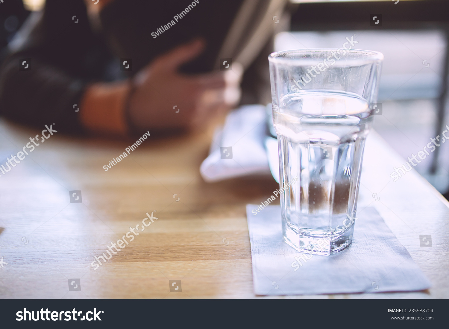 Glass of water and a man on a background #235988704