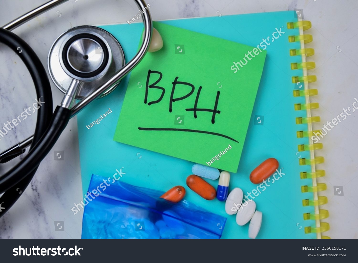 Concept of BPH write on sticky notes with stethoscope isolated on Wooden Table. #2360158171