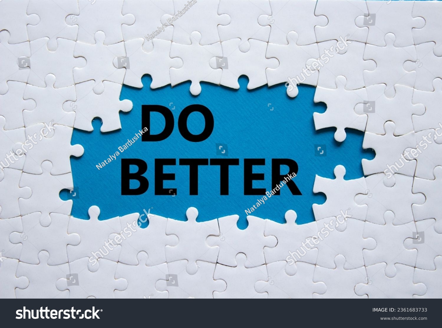 Do better symbol. White puzzle with words Do better. Beautiful blue background. Business and Do better concept. Copy space. #2361683733