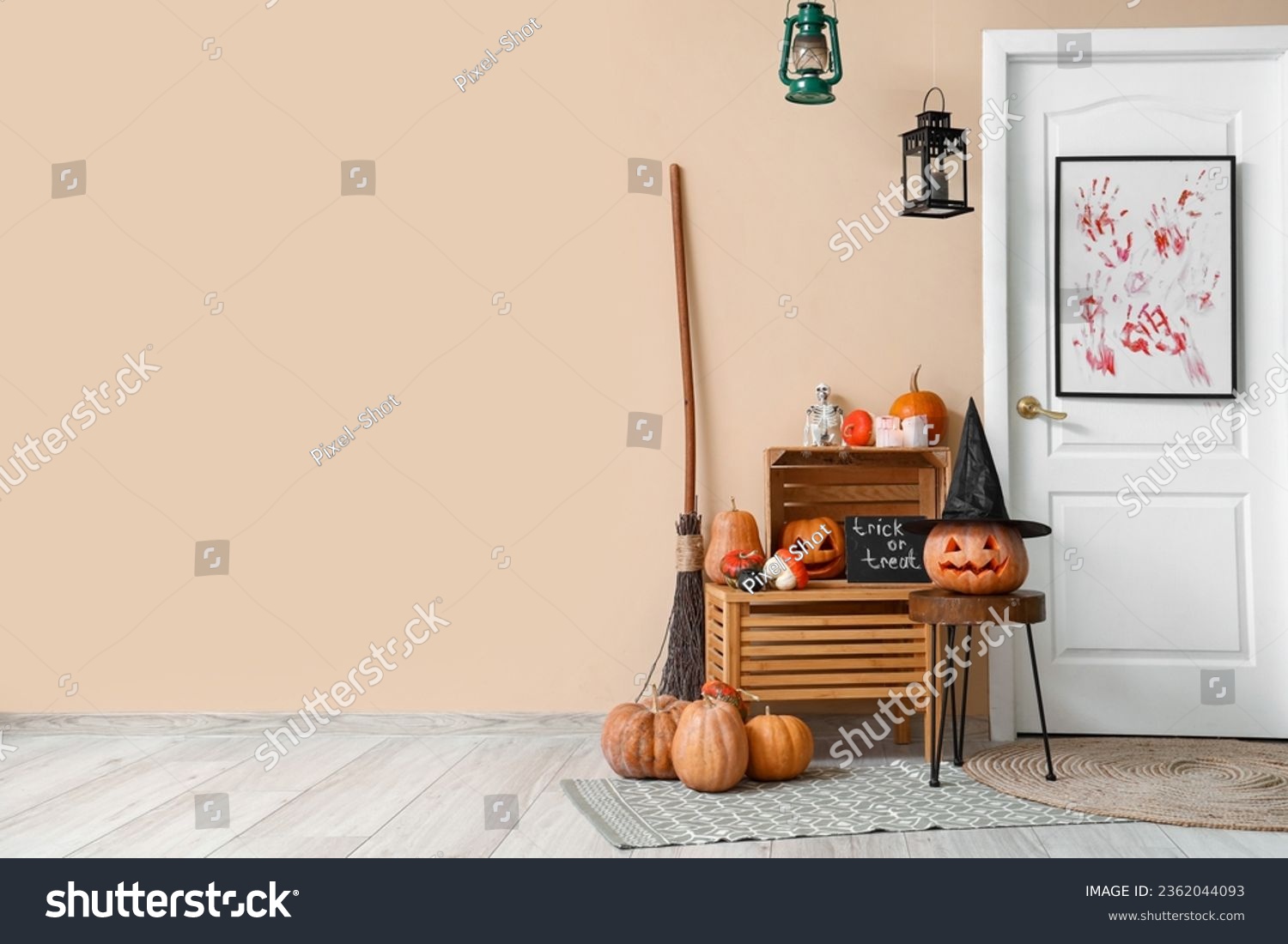 Interior of hall decorated for Halloween with door and pumpkins #2362044093
