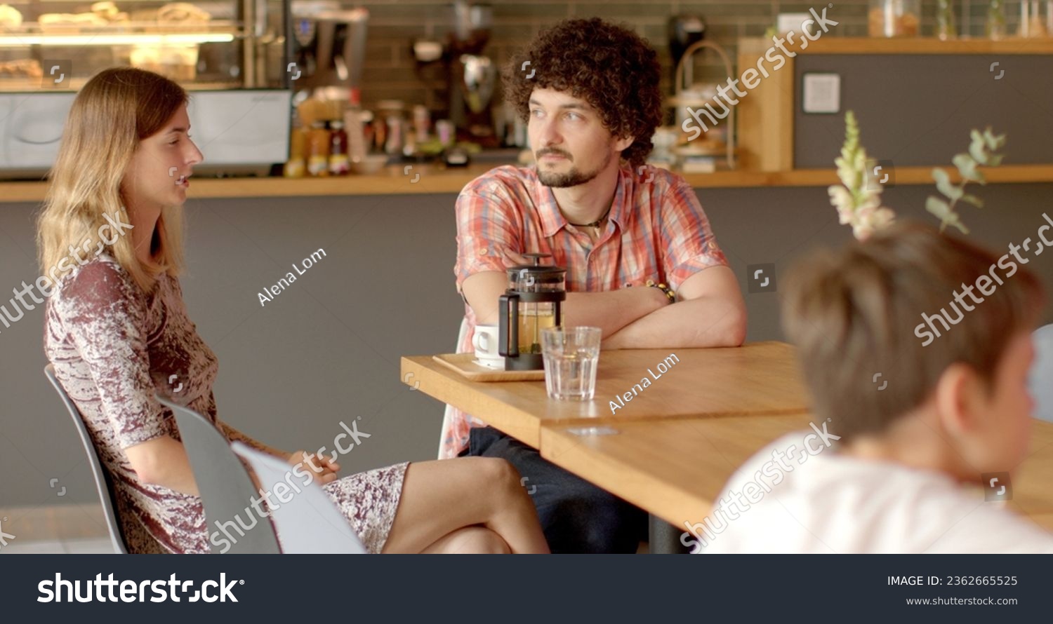 Adult siblings sit at table in restaurant, discussing childhood traumas they both experienced in past. Exchange support, advice, stories about how they cope with aftermath of their experiences. Life #2362665525