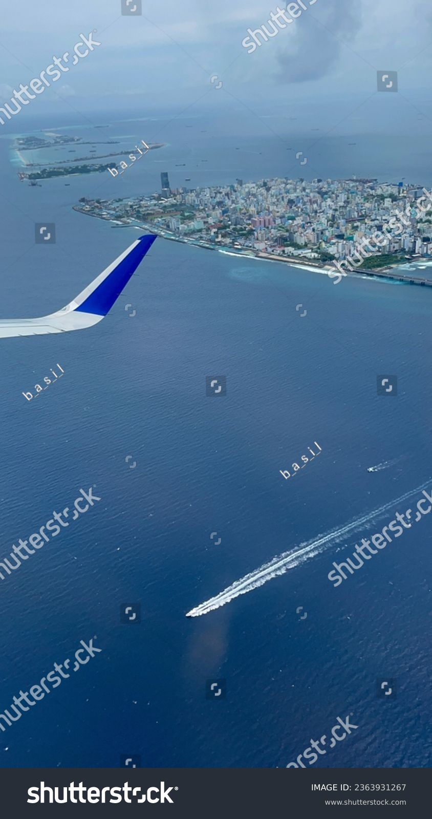 View of Maldives islands from flight. See the colour of sea. #2363931267