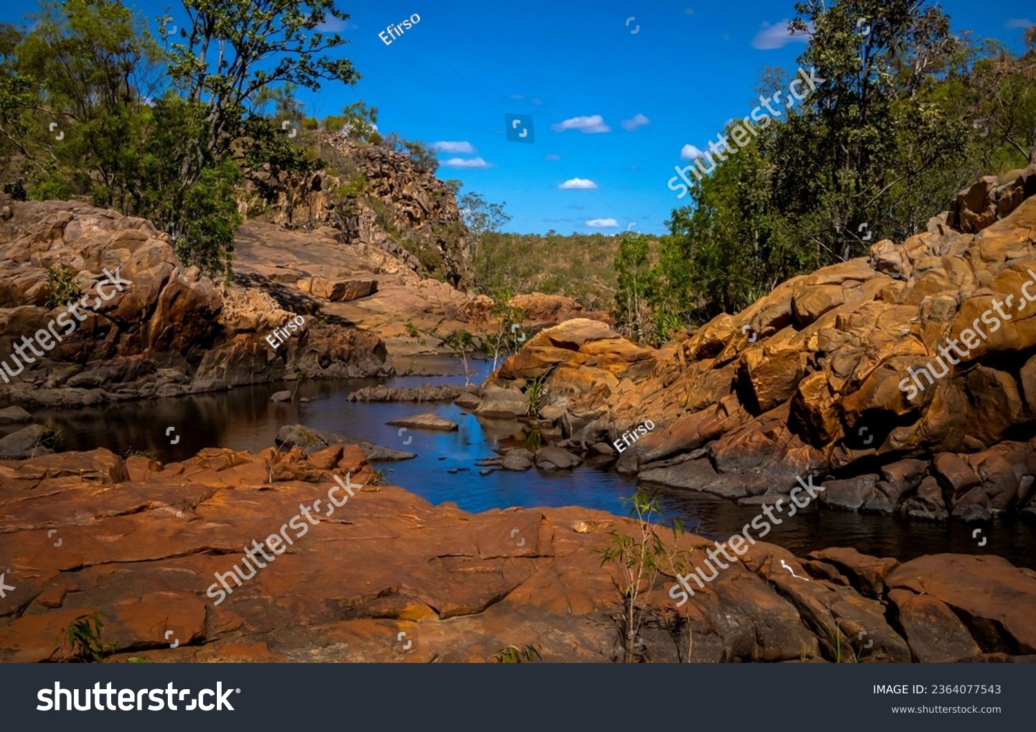 Forest stream among the stones. RIver rocks. Rocky river flowing. River in red rocks #2364077543