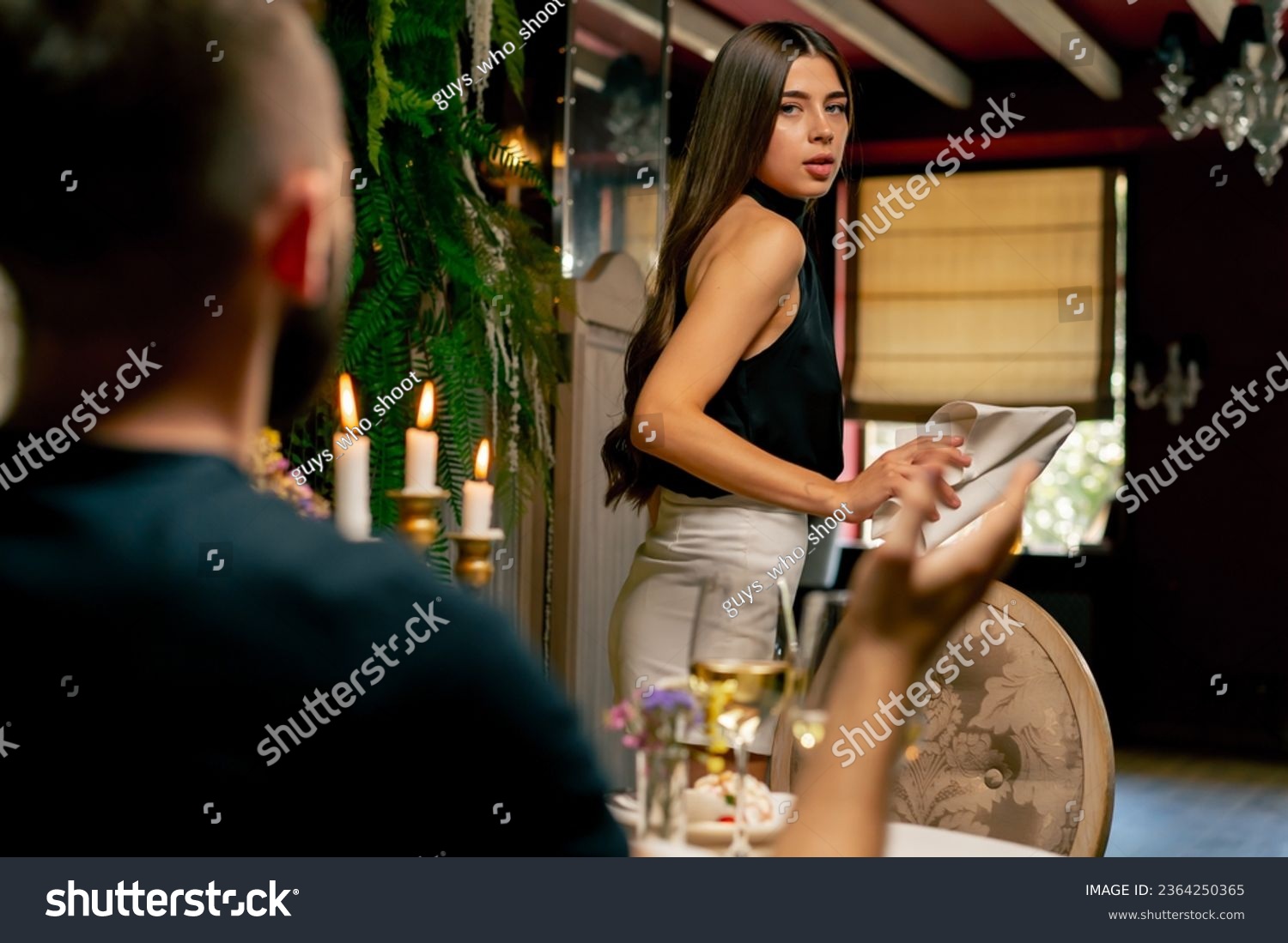 Close-up of a girl leaving a date with her boyfriend because of an argument during a date at Italian restaurant #2364250365