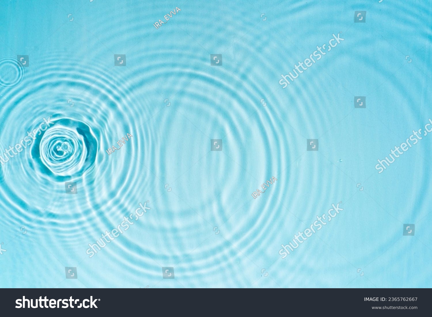 Pattern of circles on clear water from drops #2365762667