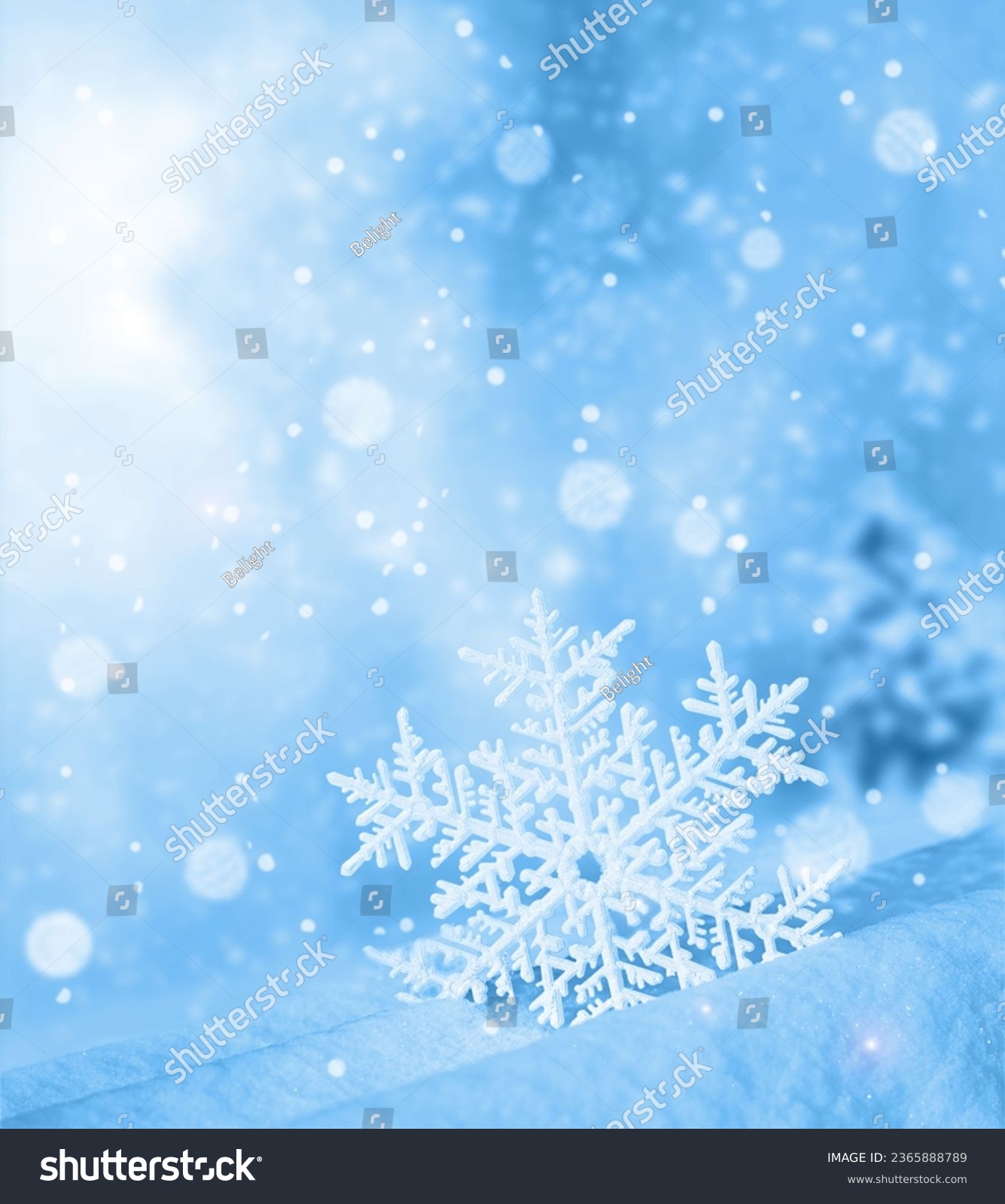 Snowflake shaped bokeh. Combined with blue background. Christmas concept. #2365888789