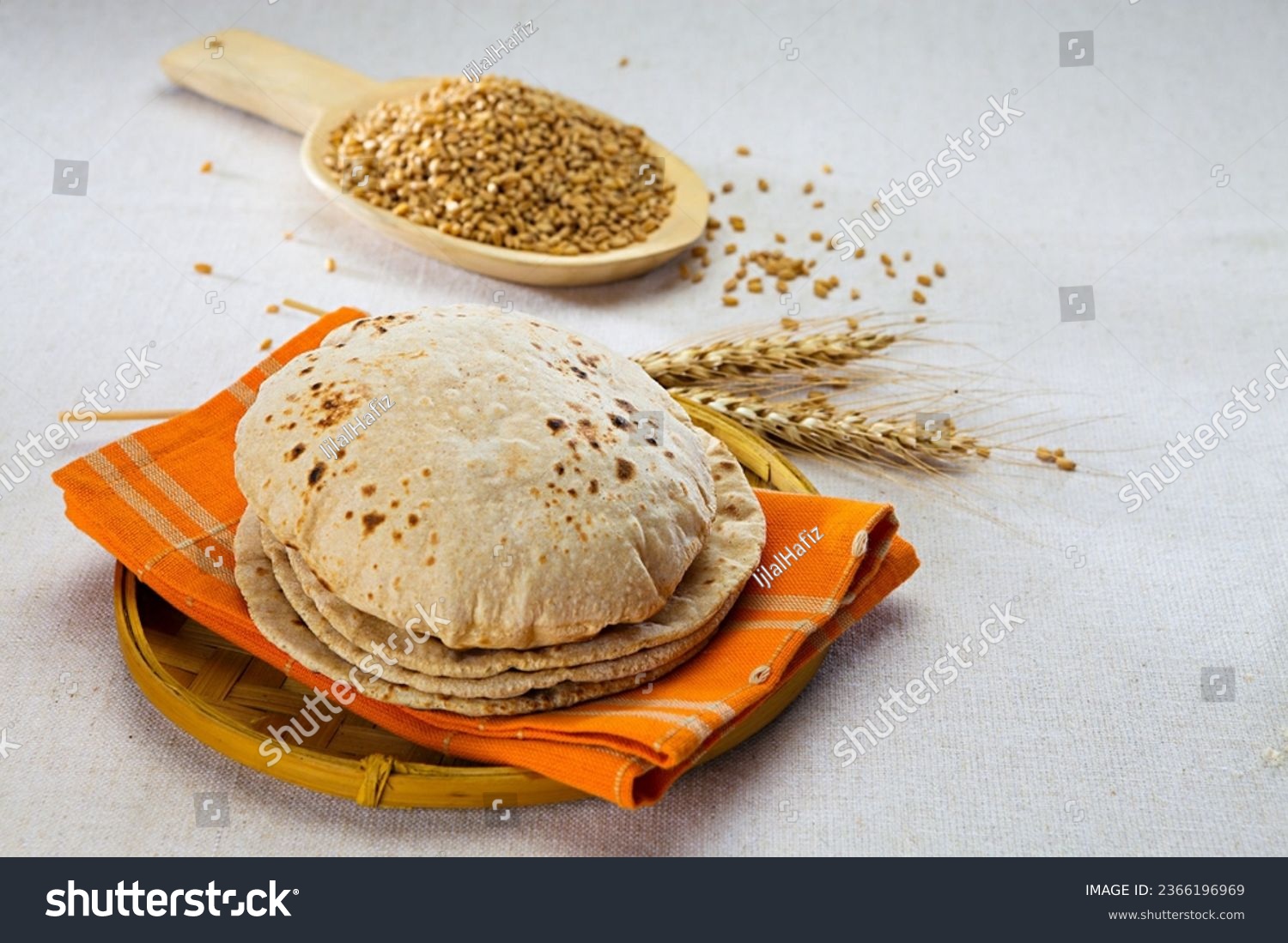 pakistan and indian bread with wheat grains in background #2366196969