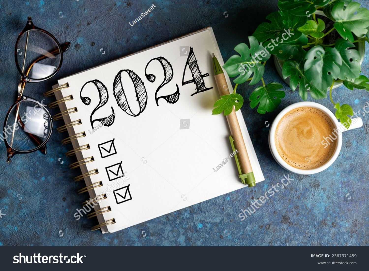 New year resolutions 2024 on desk. 2024 resolutions list with notebook, coffee cup on table. Goals, resolutions, plan, action, checklist concept. New Year 2024 template, copy space #2367371459