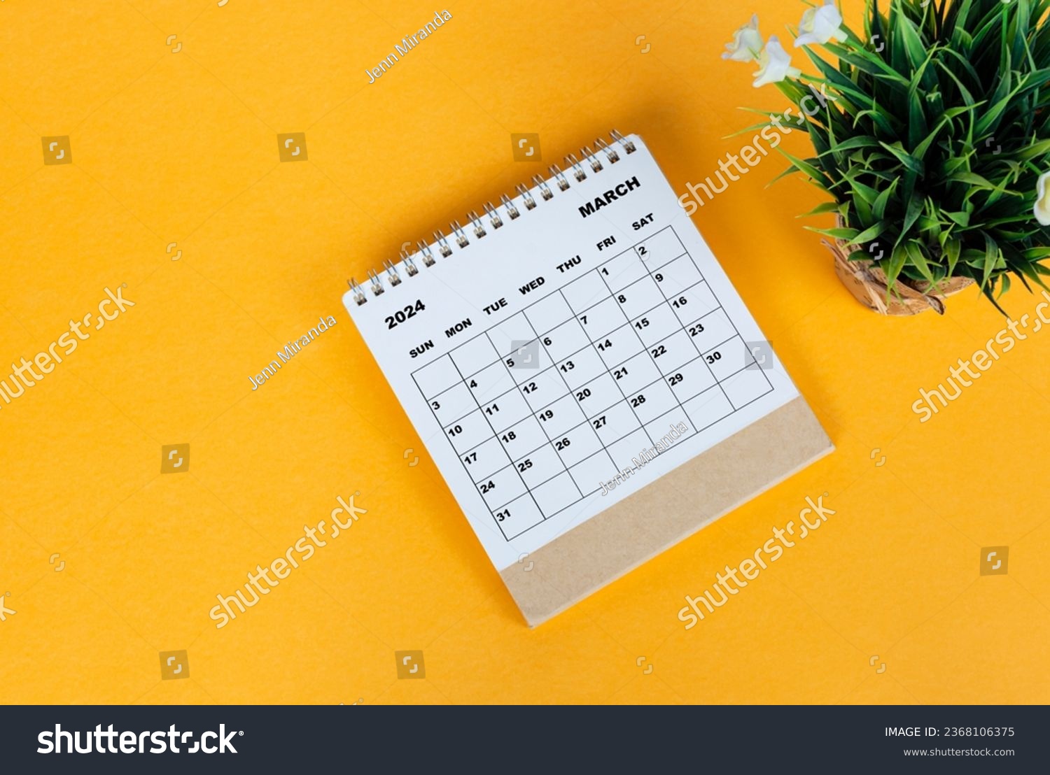 March 2024 desk calendar on yellow background. Directly above. Flat lay. Copy space. #2368106375