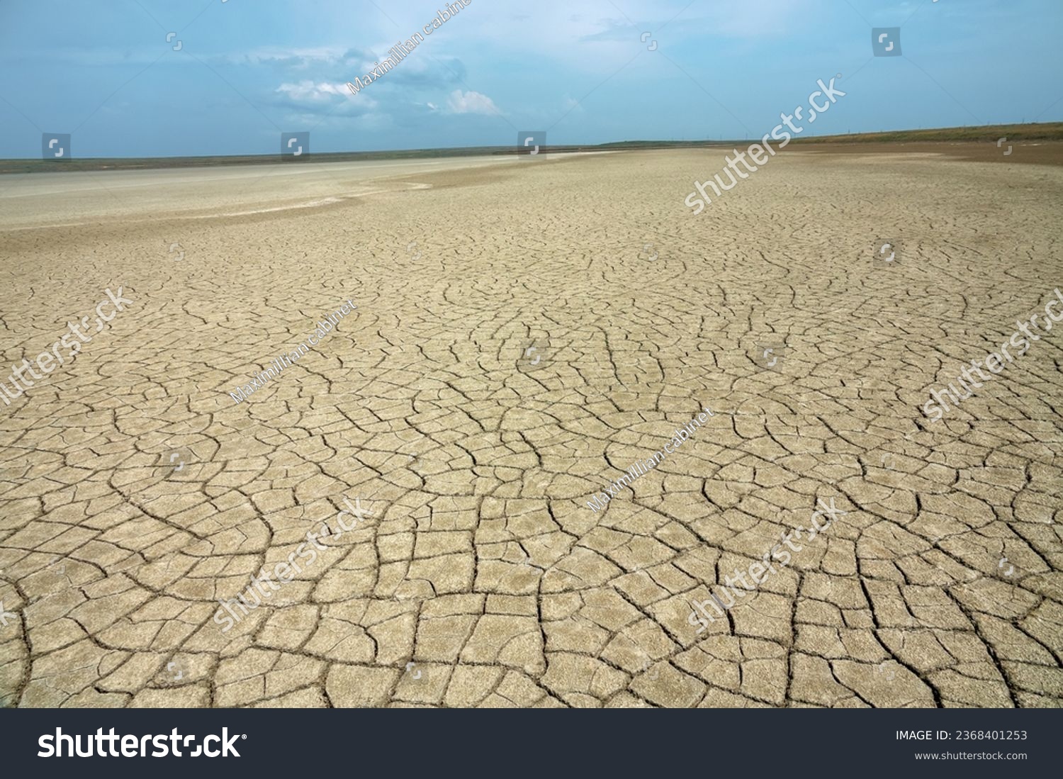 Dried-up lake basin (dry lakebed), alkali flat. Semi - desert salt-marsh. The soil is cracked - dry-type playa #2368401253