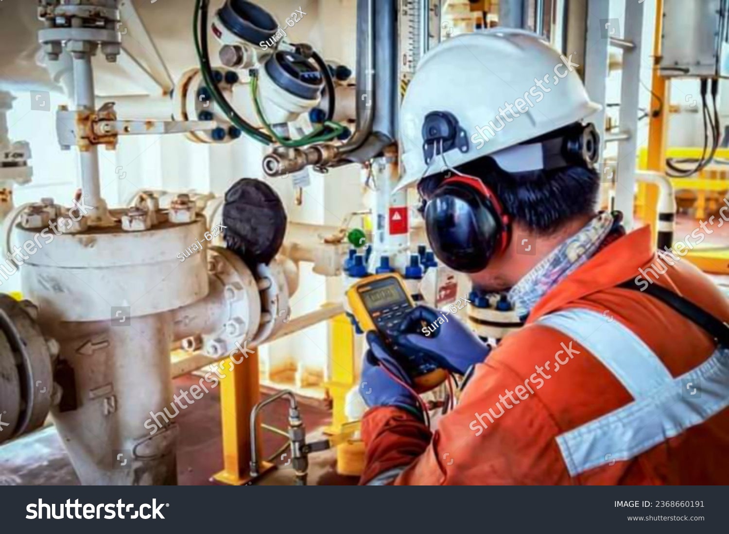 Technician,Instrument technician on the job calibrate or function check on instrument device or level transmitter in oil and gas platform offshore. #2368660191