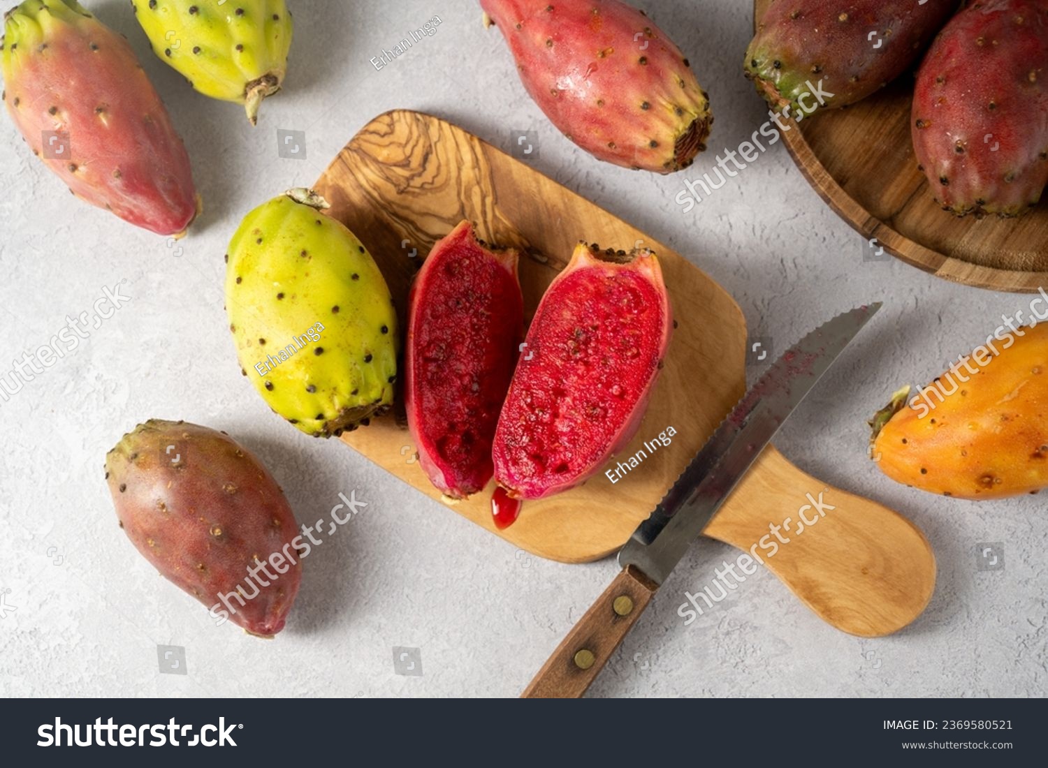 Prickly pears, exotic cactus fruits cut in halves, top view. #2369580521