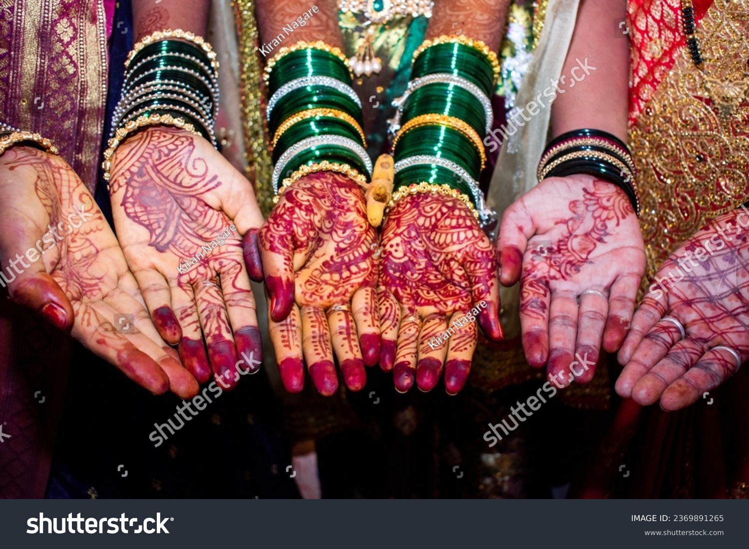Mehendi henna pattern on brides hand at a wedding, Mehndi hands close up #2369891265