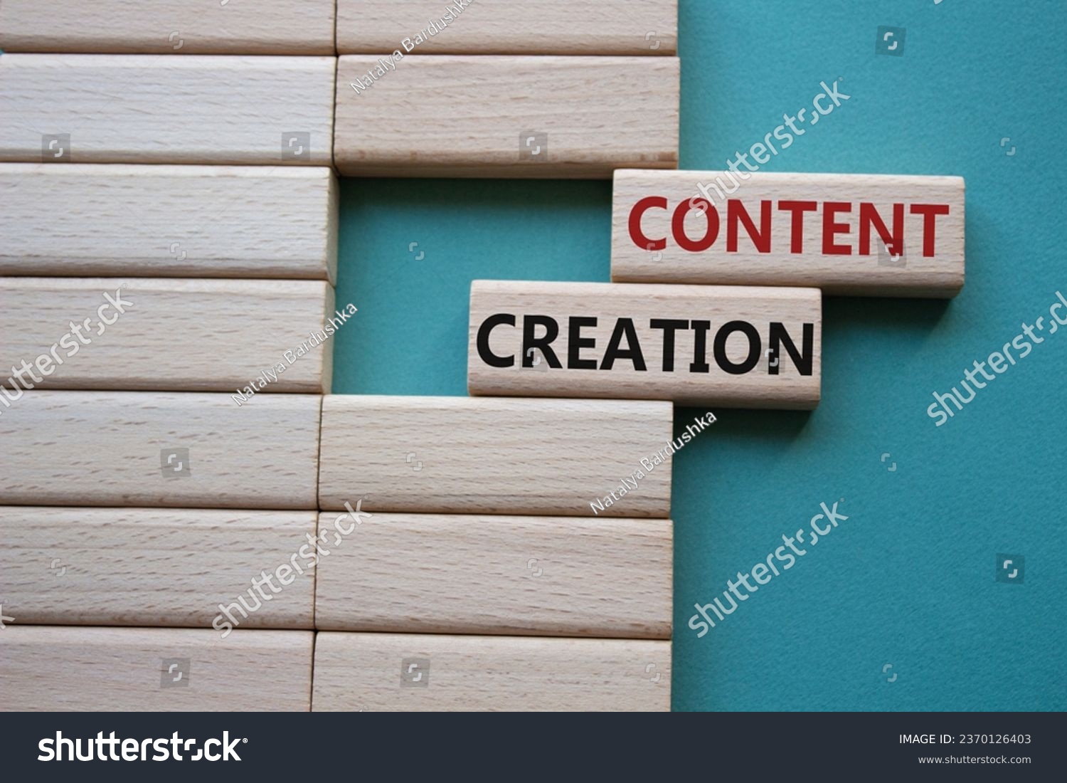 Content creation symbol. Concept word Content creation on wooden blocks. Businessman hand. Beautiful grey green background. Business and Content creation concept. Copy space #2370126403