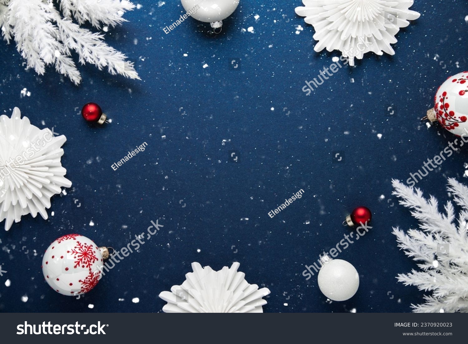 Merry Christmas and Happy Holidays greeting card, frame, banner. New Year. Noel. White Christmas white and red ornaments on blue background top view. Winter holiday xmas theme. Flat lay. #2370920023