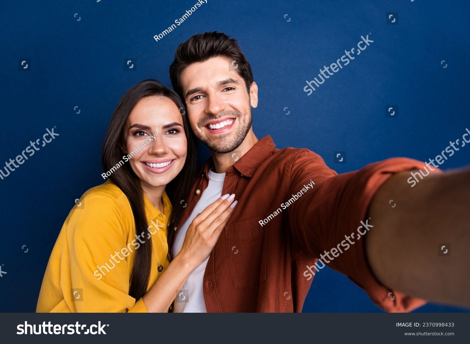 Portrait of two positive idyllic partners toothy smile cuddle take selfie isolated on dark blue color background #2370998433