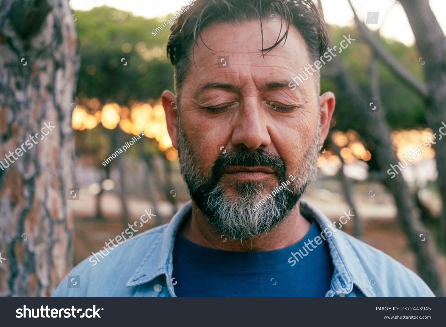 Close up Sad man portrait expression face close up in outdoor park. One adult mature male people with closed eyes . Problems on life. Mental burnout. Depression and therapy. Life trouble person #2372443945