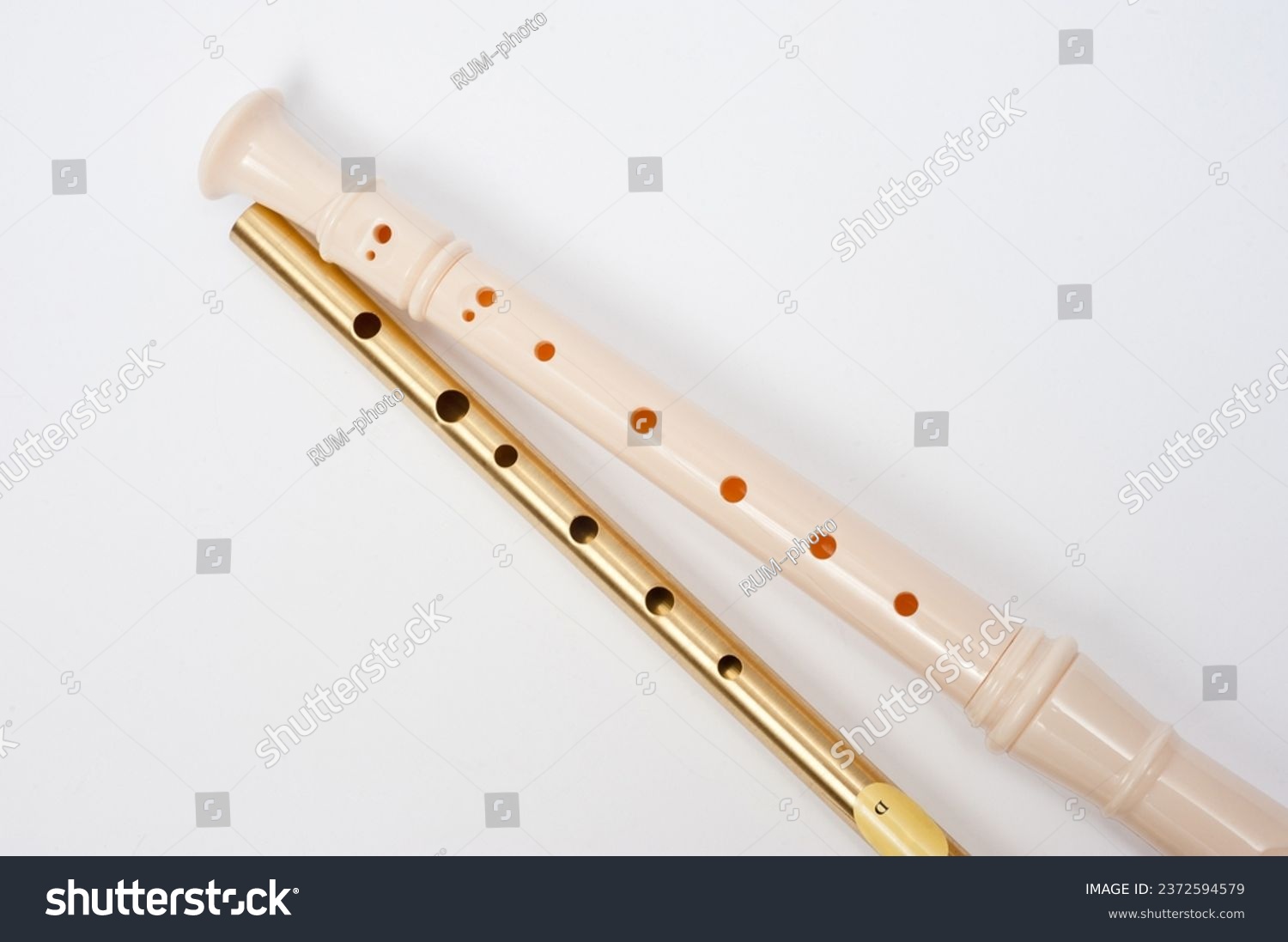 Irish whistle and block flute are longitudinal flutes with a whistle device and playing holes. #2372594579