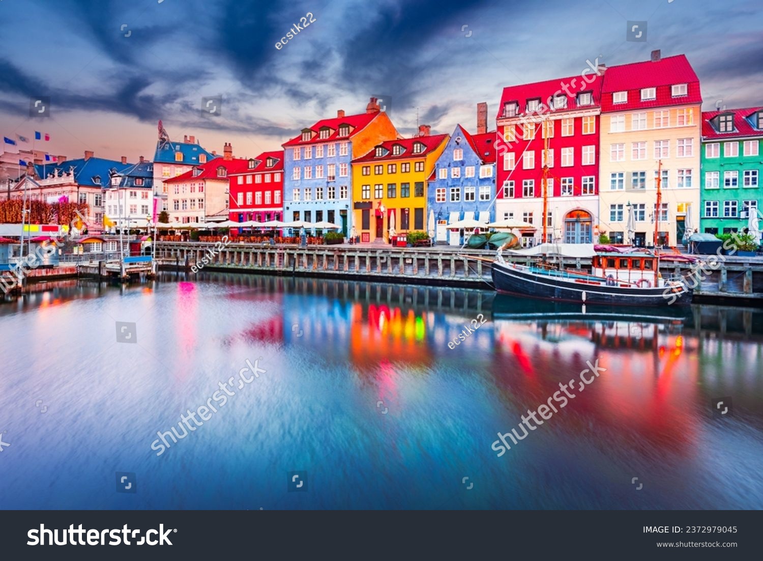 Charm of Copenhagen, Denmark at Nyhavn. Iconic canal, colorful night image and breathtaking water reflections. #2372979045
