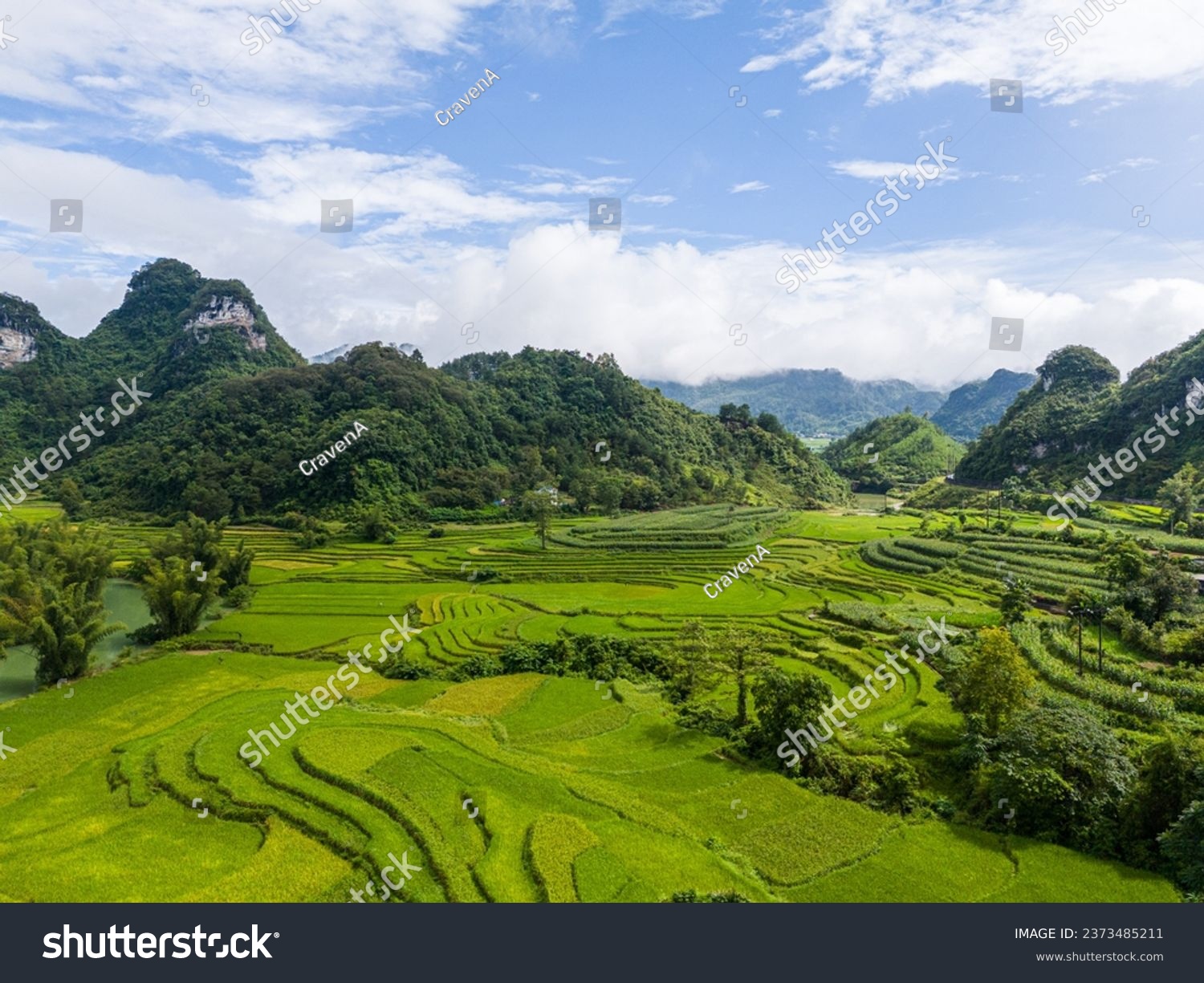 Aerial landscape in Quay Son river, Trung Khanh, Cao Bang, Vietnam with nature, green rice fields and rustic indigenous houses. Travel and landscape concept. #2373485211