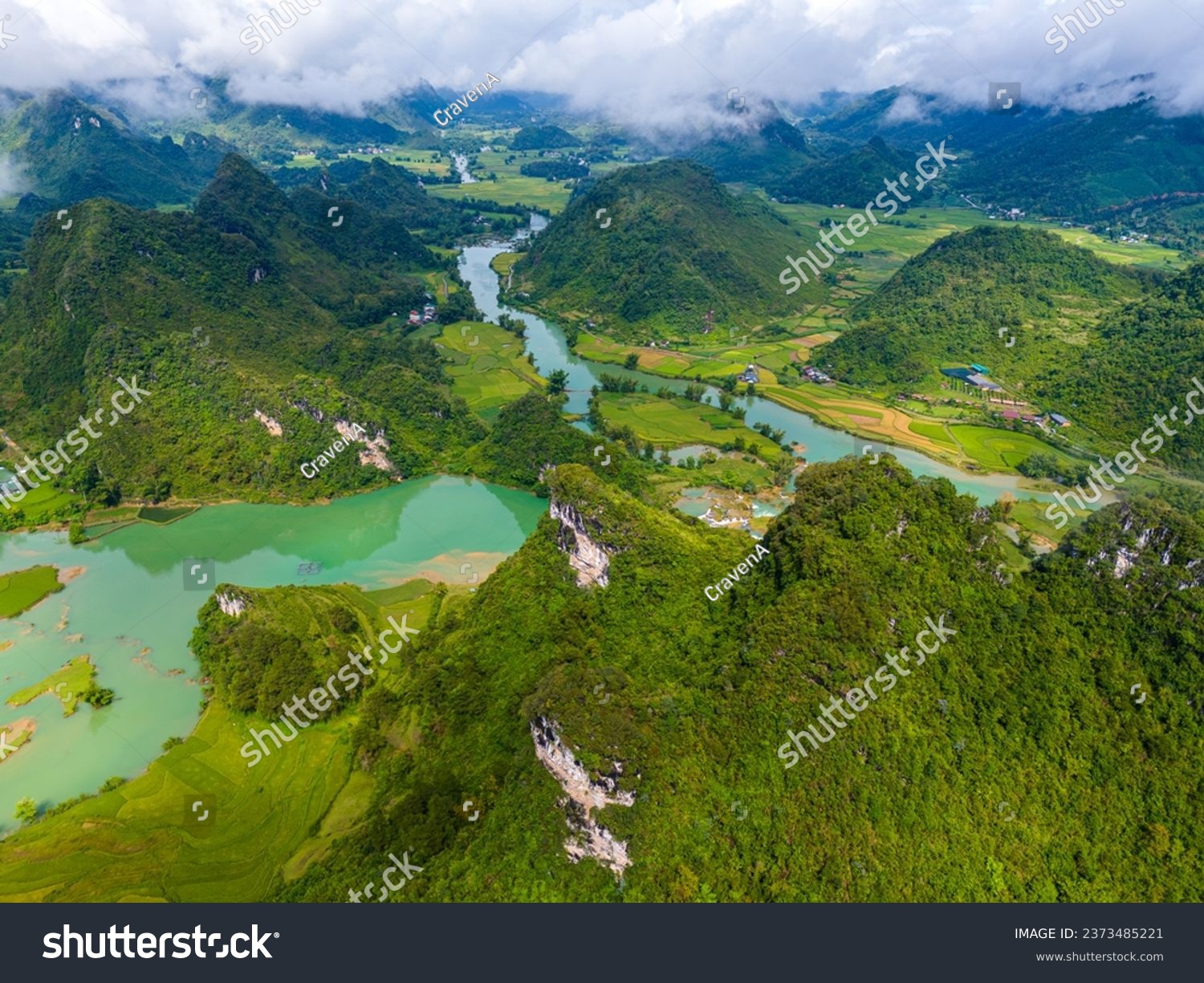 Aerial landscape in Quay Son river, Trung Khanh, Cao Bang, Vietnam with nature, green rice fields and rustic indigenous houses. Travel and landscape concept. #2373485221