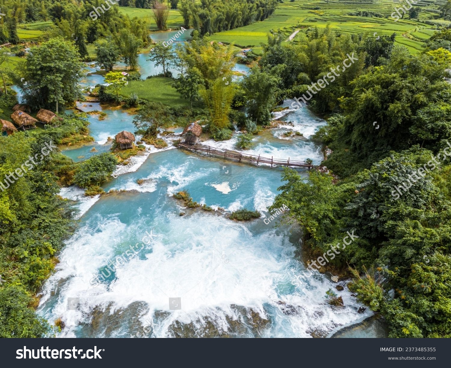 Aerial landscape in Quay Son river, Trung Khanh, Cao Bang, Vietnam with nature, green rice fields and rustic indigenous houses. Travel and landscape concept. #2373485355